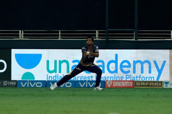 Shivam Mavi takes the catch to dismiss Nicholas Pooran off the bowling of Varun Chakravarthy.