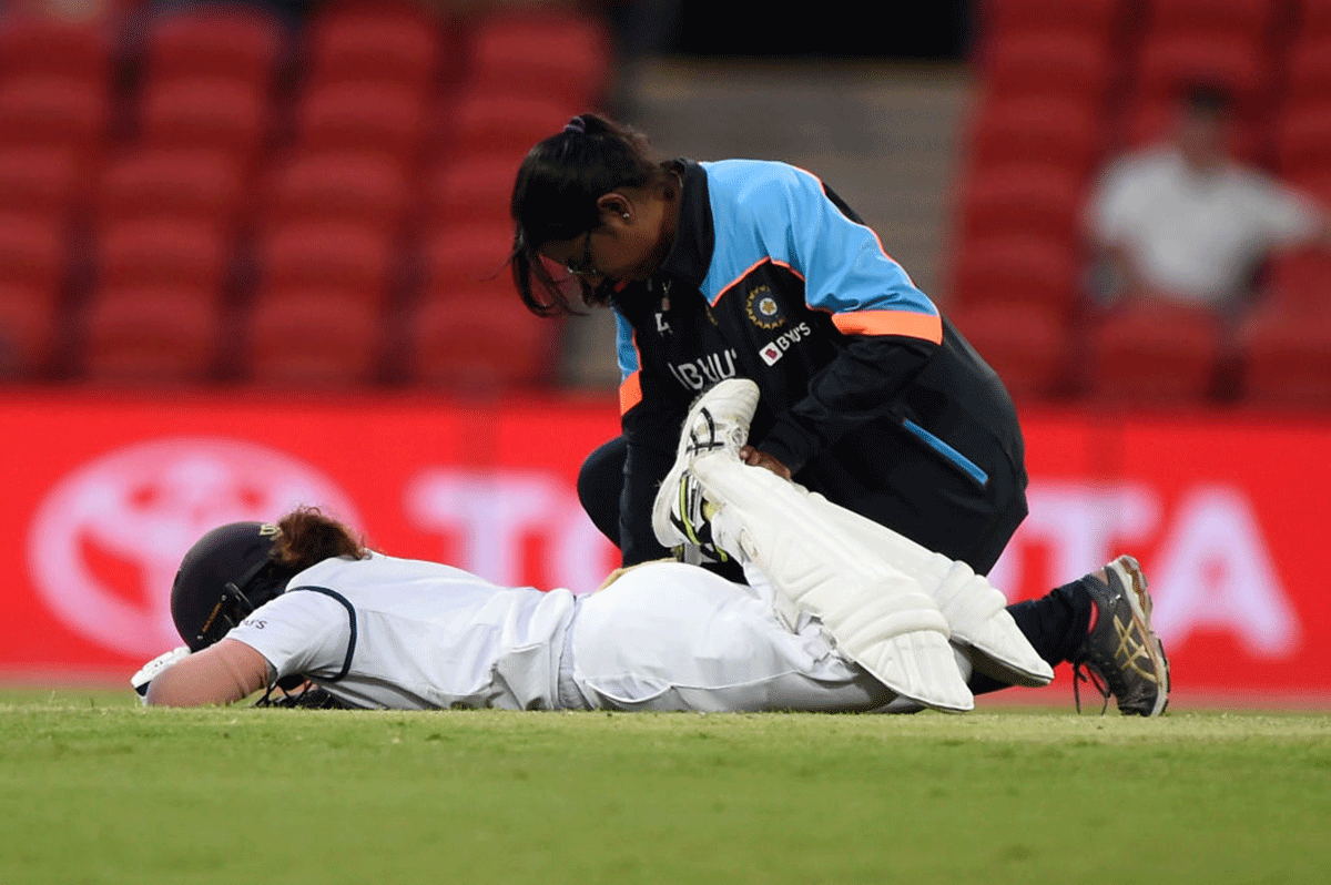 India's Mithali Raj receives medical attention on the field