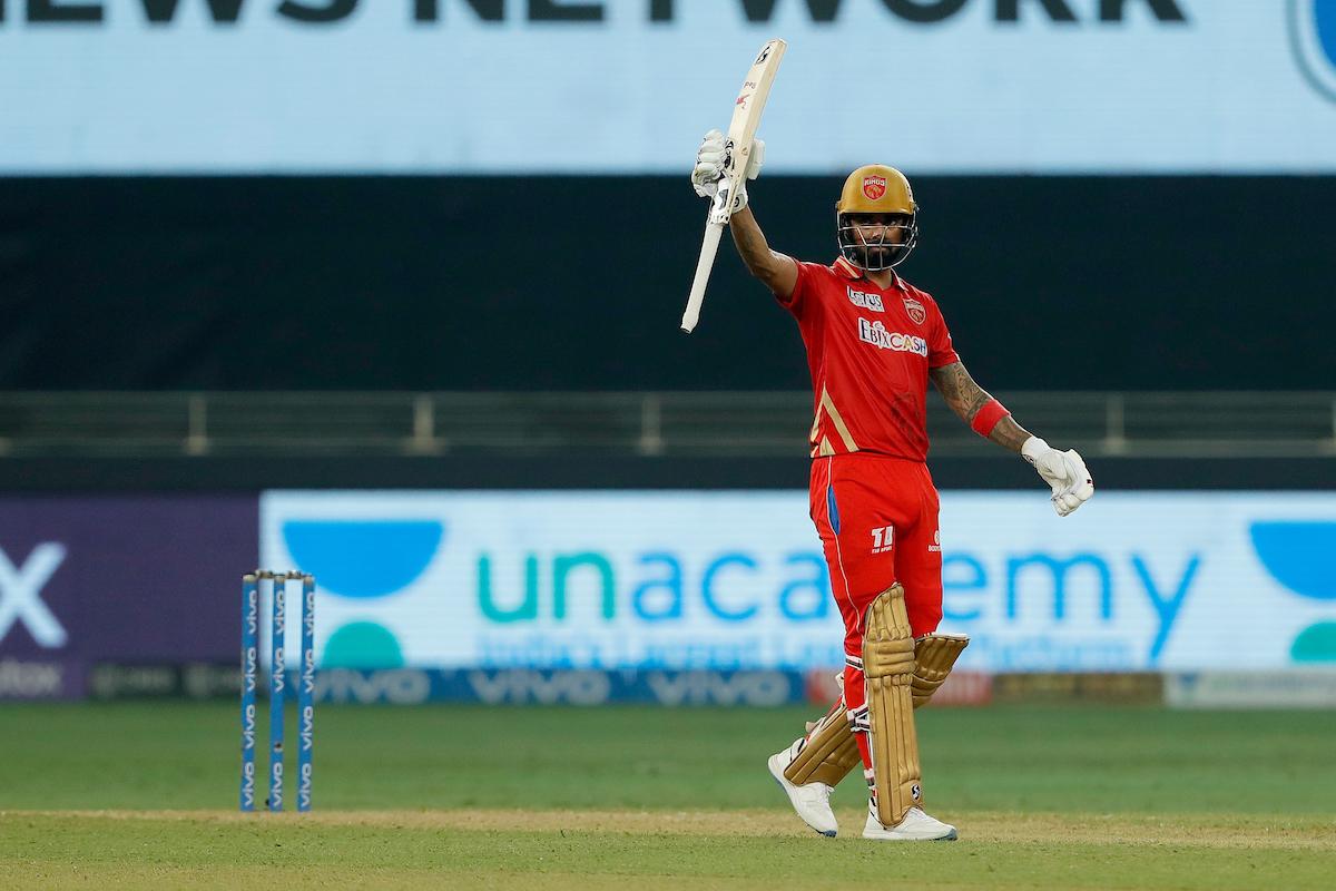 Opener K L Rahul waves to the Punjab Kings dressing room after completing a half century.