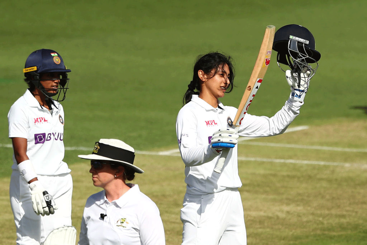 India's Smriti Mandhana celebrates her century on day two of the Women's International Test Match against Australia at Metricon Stadium in Gold Coast on Friday