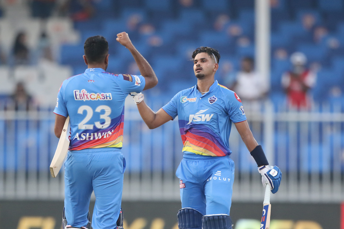 Ravichandran Ashwin, left, and Shreyas Iyer celebrate after guiding Delhi Capitals to victory over Mumbai Indians in the Indian Premier League match, in Sharjah, on Saturday.