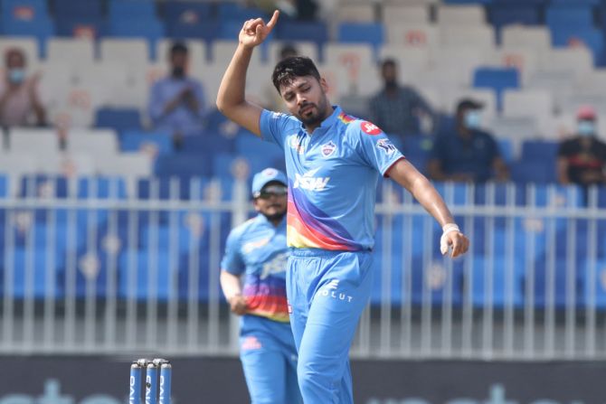 Delhi Capitals pacer Avesh Khan celebrates after dismissing Mumbai Indians captain Rohit Sharma in the Indian Premier League match, in Sharjah, on Saturday.