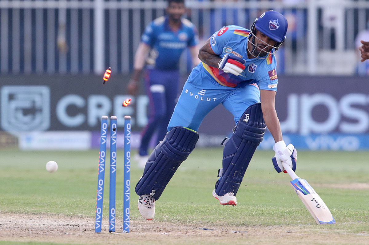 Shikhar Dhawan of Delhi Capitals gets run out by Kieron Pollard.