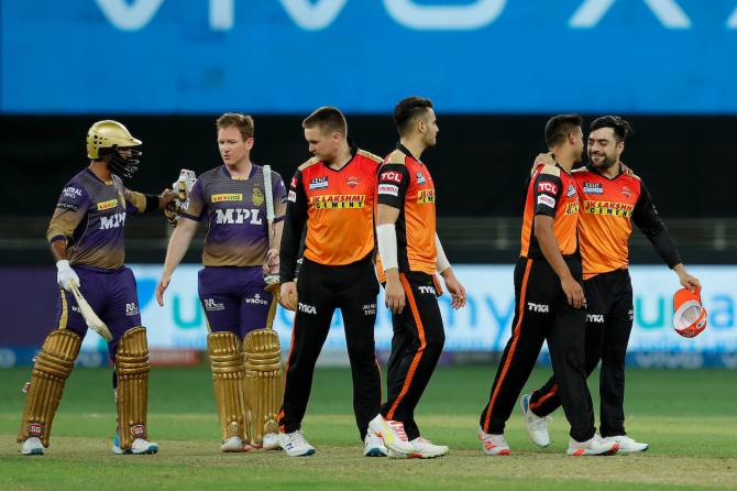 Kolkata Knight Riders batters Dinesh Karthik and Eoin Morgan walk back after clinching victory