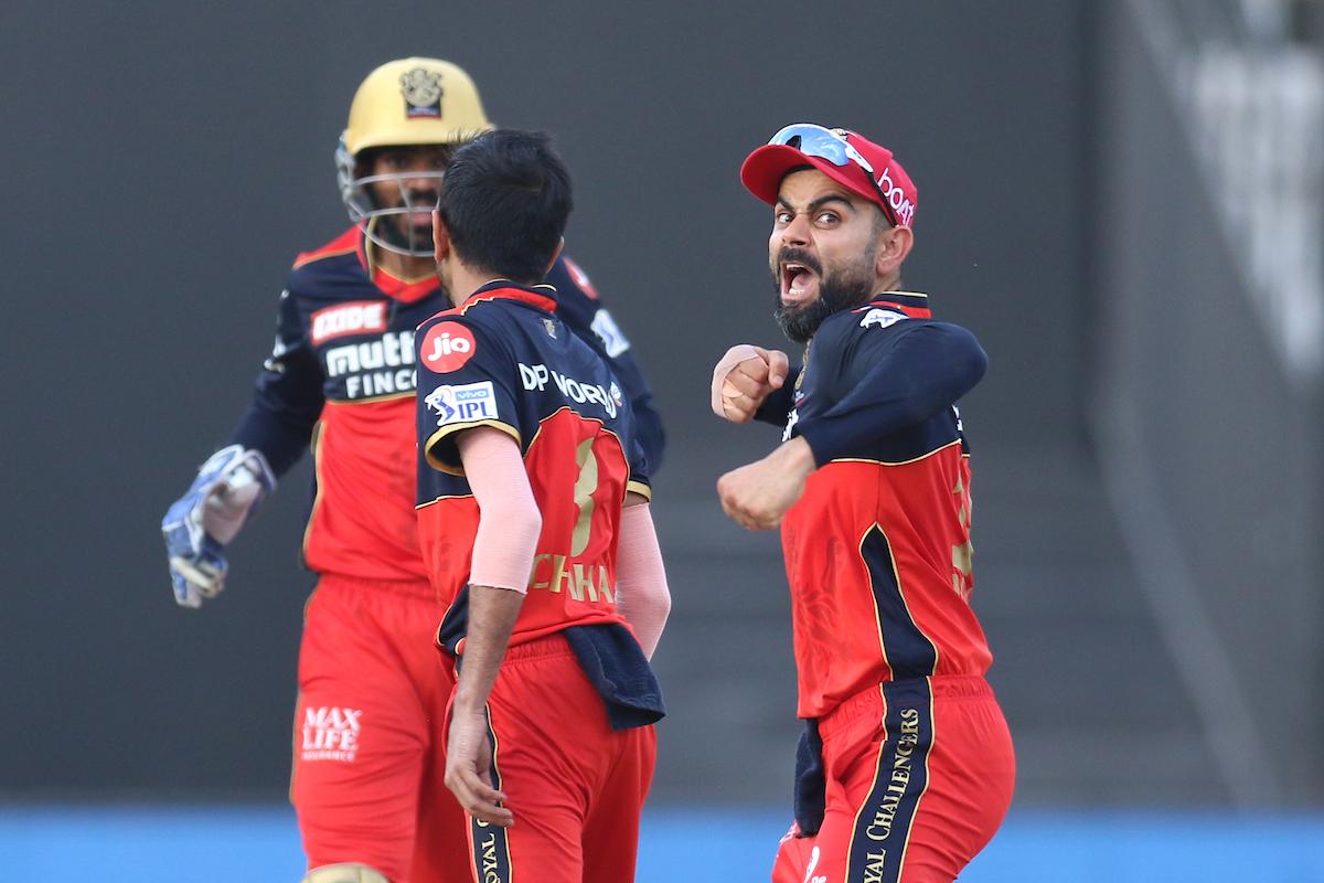 Royal Challengers Bangalore captain Virat Kohli celebrates after Yuzvendra Chahal dismisses Nicholas Pooran during the Indian Premier League match against Punjab Kings, in Sharjah, on Sunday.