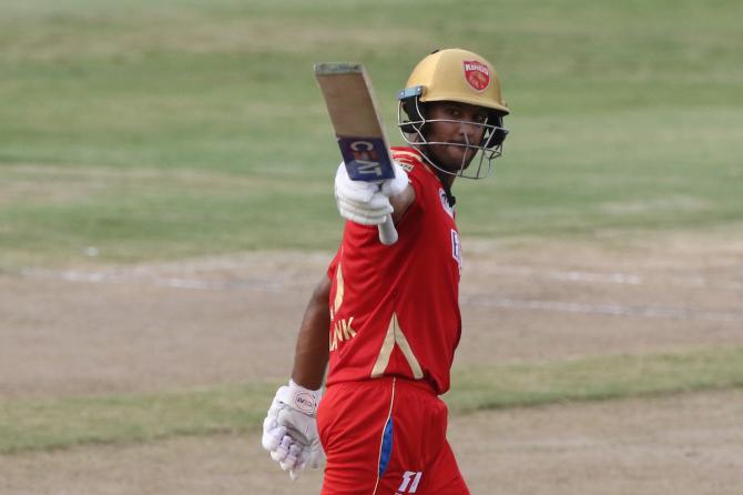 Punjab Kings opener Mayank Agarwal celebrates after scoring 50.