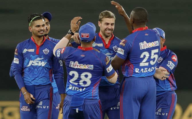 Delhi Capitals pacer Anrich Nortje celebrates with teammates after taking the wicket of Ruturaj Gaikwad.