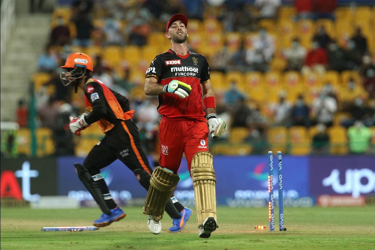 Glenn Maxwell reacts as Wriddhiman Saha celebrates his run-out.