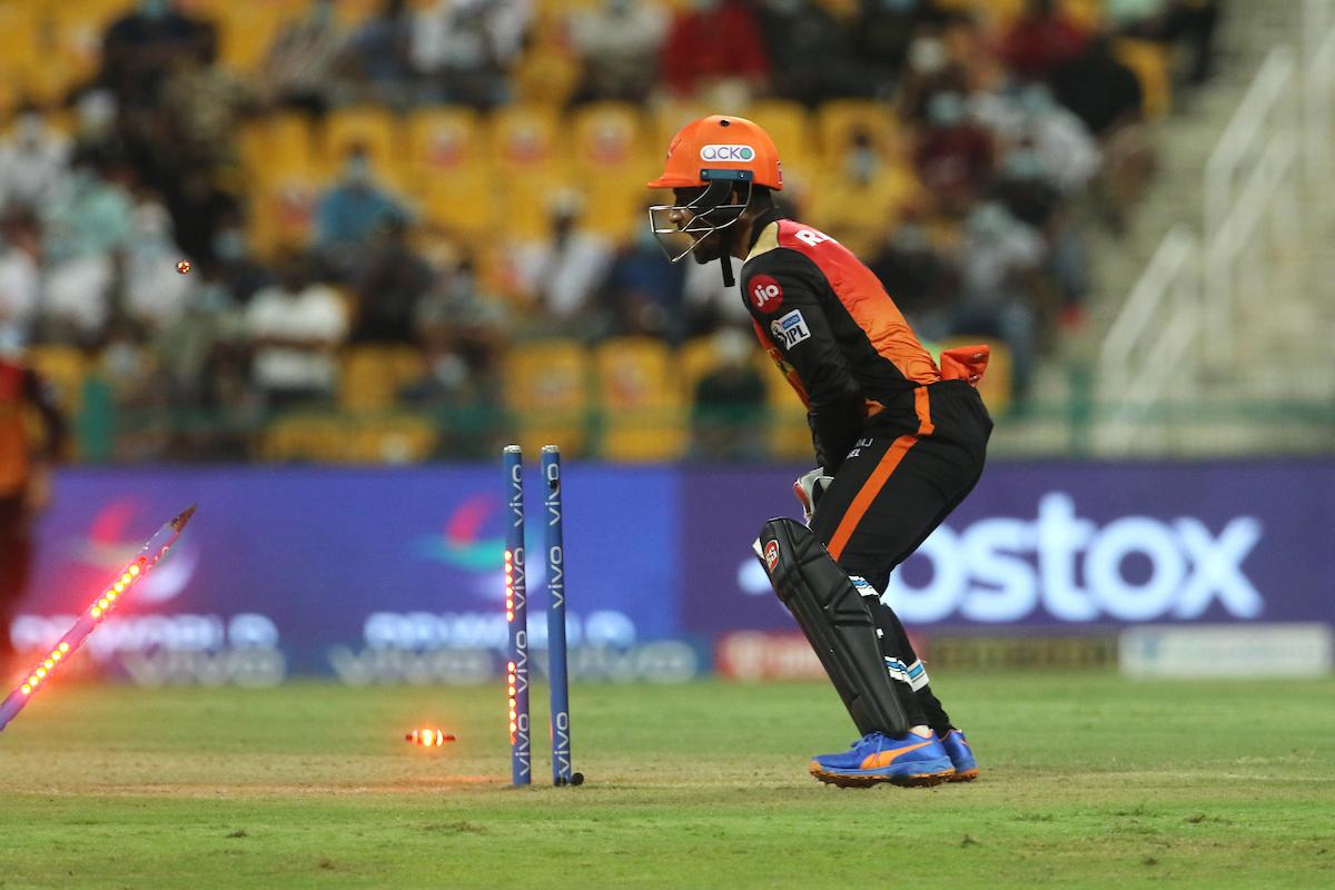 Sunrisers Hyderabad wicketkeeper Wriddhiman Saha watches as Glenn Maxwell is run-out by Kane Williamson.