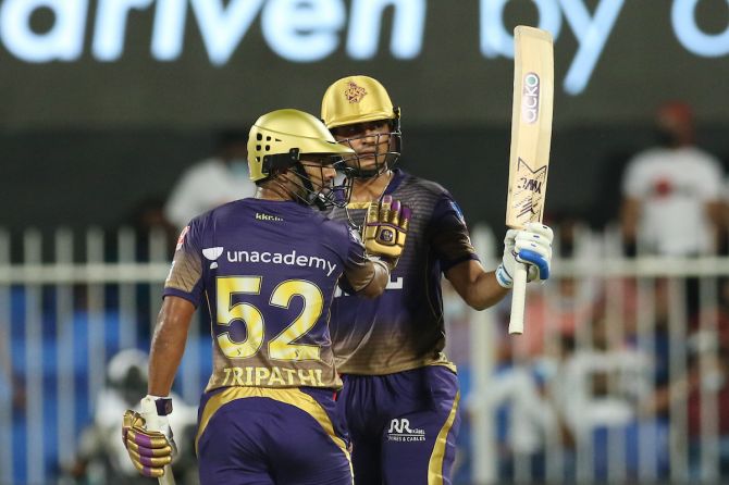 Kolkata Knight Riders opener Shubman Gill waves to the dressing the room after completing 50.