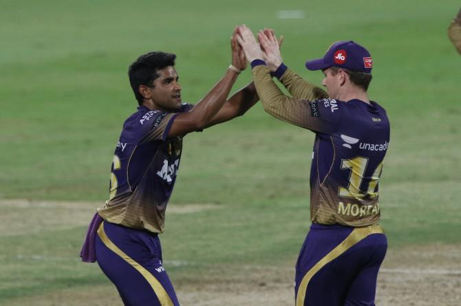 Shivam Mavi celebrates with Kolkata Knight Riders skipper Eoin Morgan after dismissing Sanju Samson.