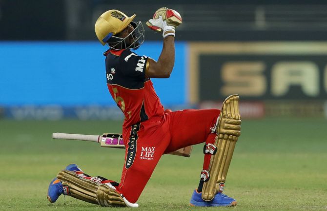Srikar Bharat celebrates taking Royal Challengers Bangalore past Delhi Capitals with a six in the Indian Premier League match in Dubai on Friday.