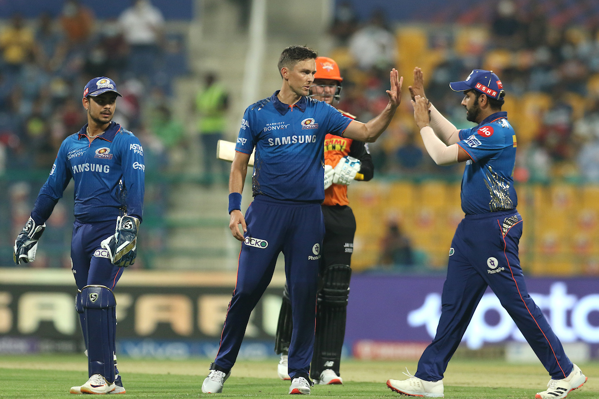 Trent Boult celebrates with skipper Rohit Sharma after dismissing Jason Roy.