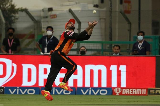 Mohammad Nabi takes a splendid catch to dismiss Rohit Sharma.