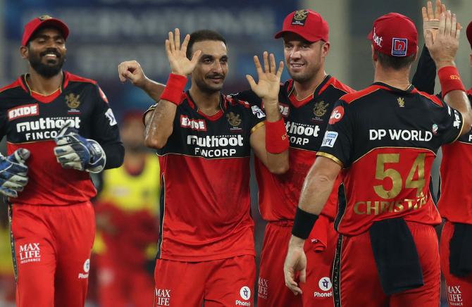 Harshal Patel celebrates the wicket of Shikhar Dhawan.