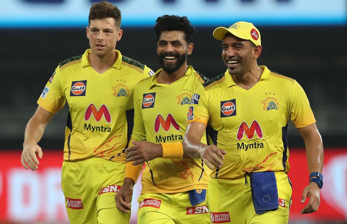 Ravindra Jadeja, centre, celebrates with team-mates after taking the wicket of Prithvi Shaw