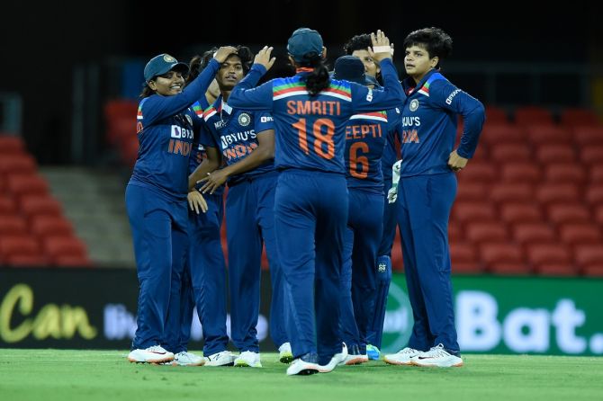 India’s players celebrate after Pooja Vastrakar dismisses Australia’s Ashleigh Gardner during the third women’s T20, at Metricon Stadium in Gold Coast, Australia, on Sunday.