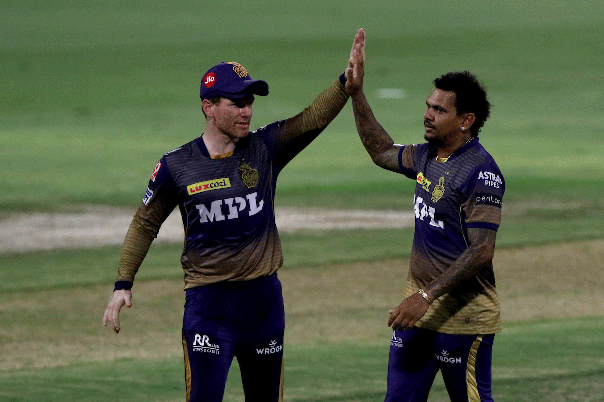 Sunil Narine celebrates with Kolkata Knight Riders Captain Eoin Morgan after dismissing Virat Kohli. 