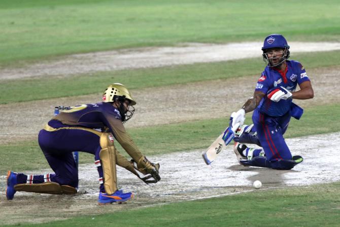 Kolkata Knight Riders wicketkeeper Dinesh Karthik makes a mess of a chance to stump Shikhar Dhawan.