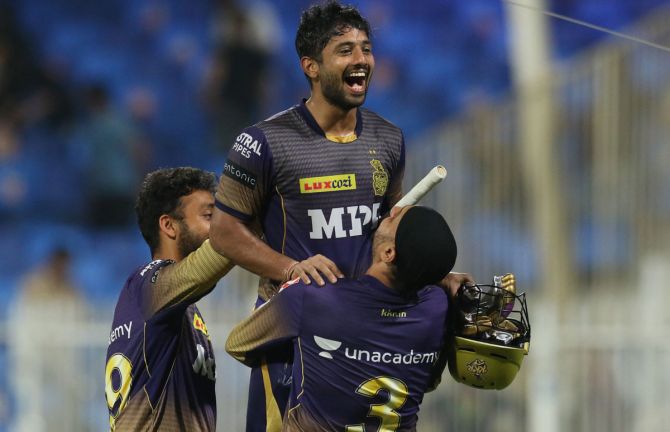 Rahul Tripathi is hoisted by Harbhajan Singh after hitting the winning six for Kolkata Knight Riders in Qualifier 2 of the Indian Premier League, in Sharjah, on Wednesday.