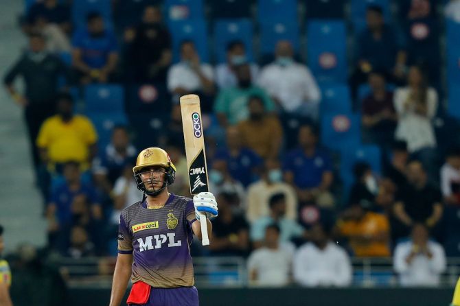 Shubman Gill waves to the Kolkata Knight Riders dressing room after completing 50