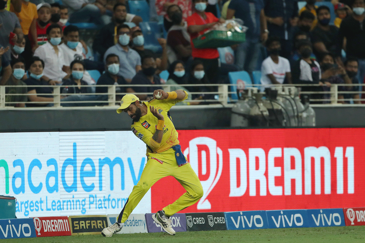 Ravindra Jadeja makes sure he does not step on the boundary rope after catching Sunil Narine