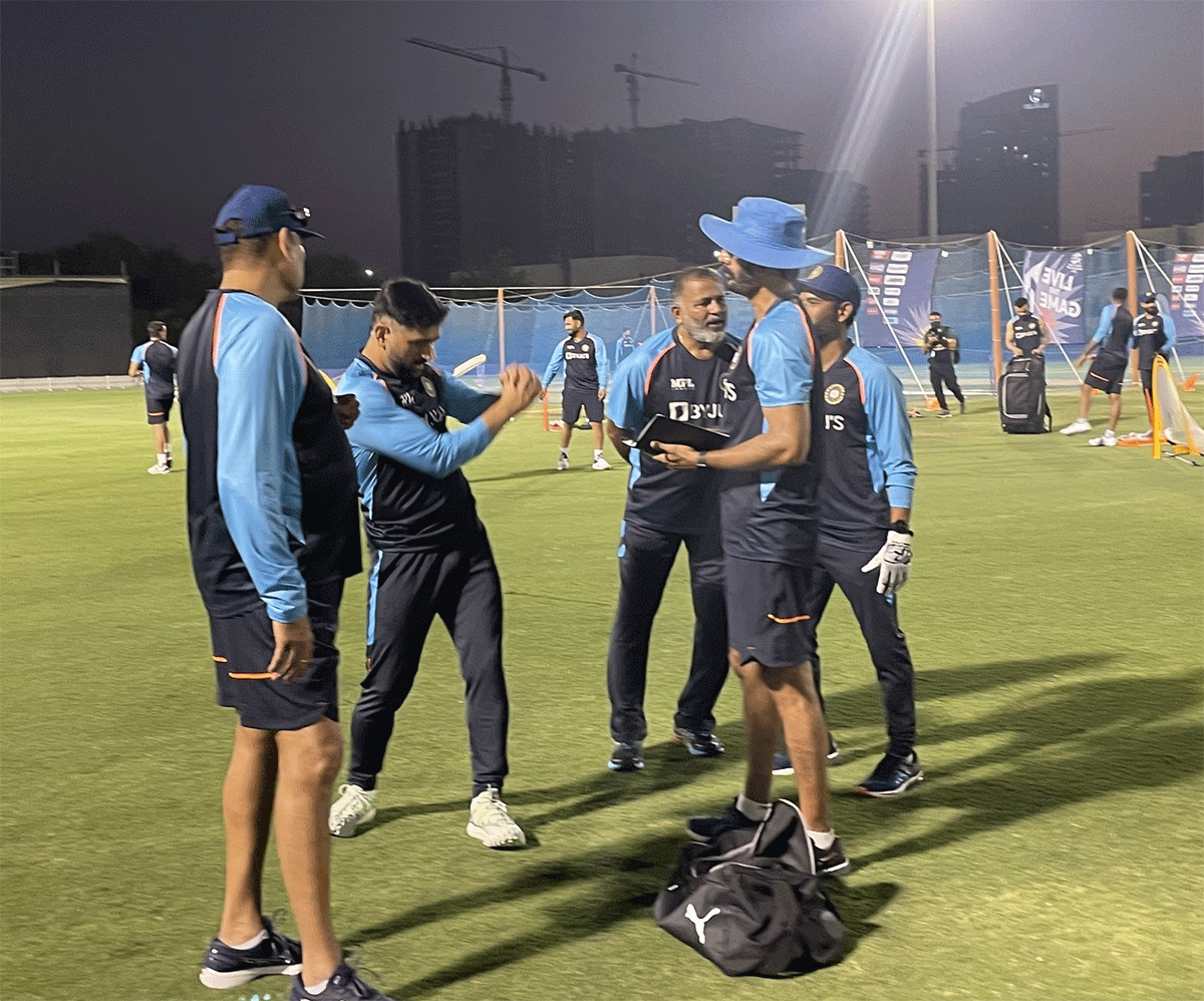 India team mentor Mahendra Singh Dhoni with the team's coaching staff during a team training session on Sunday