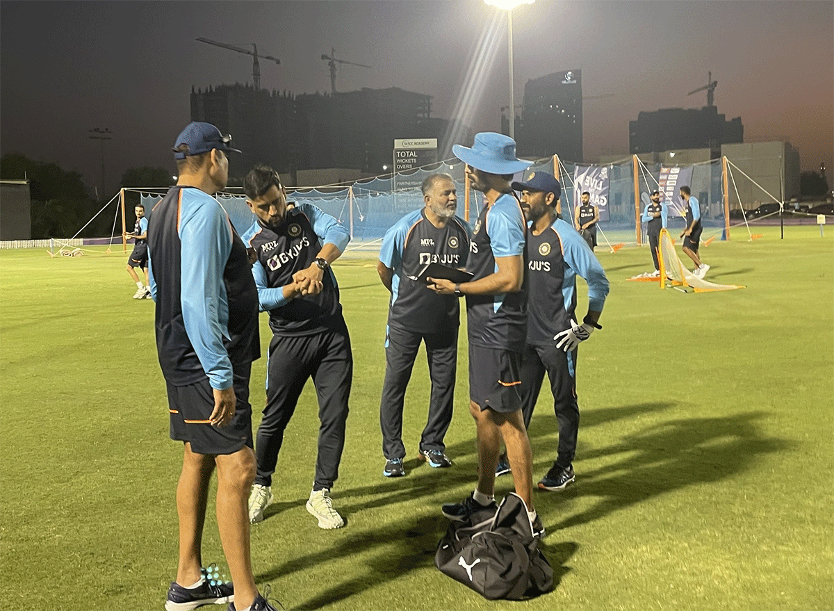 India team mentor Mahendra Singh Dhoni with the team's coaching staff during a team training session on Sunday