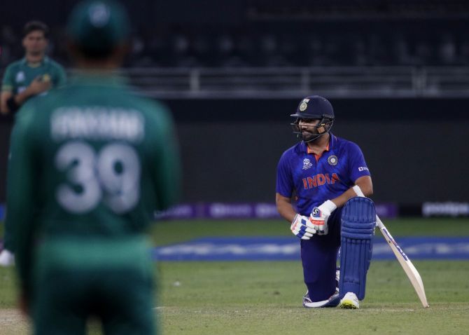 Rohit Sharma takes a knee along with India's players ahead of the T20 World Cup match against Pakistan, at Dubai International Stadium, on Sunday. 