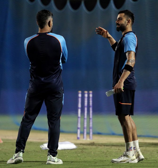 India captain Virat Kohli interacts with team mentor Mahendra Singh Dhoni during Saturday's practice session