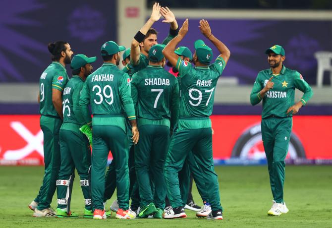 Pakistan pacer Shaheen Afridi celebrates after dismissing India opener Rohit Sharma.