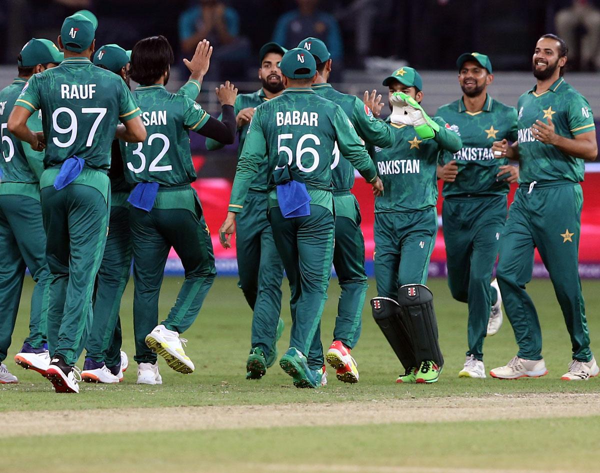 Hasan Ali celebrates with teammates after taking the wicket of Suryakumar Yadav.