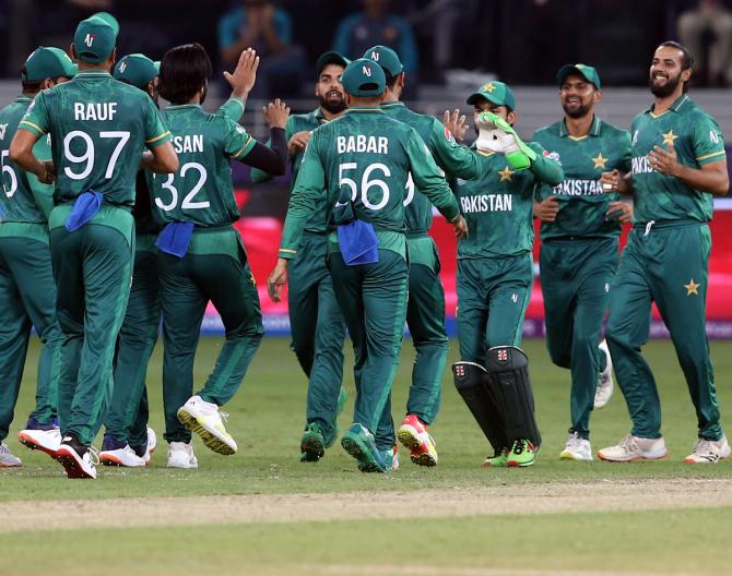 Hasan Ali celebrates with teammates after taking the wicket of Suryakumar Yadav.