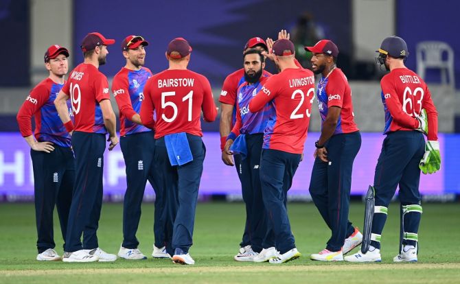 Spinner Adil Rashid celebrates with his England teammates after dismissing Andre Russell during the ICC men's T20 World Cup match against the West Indies, at Dubai International Stadium in the UAE, on Saturday. 