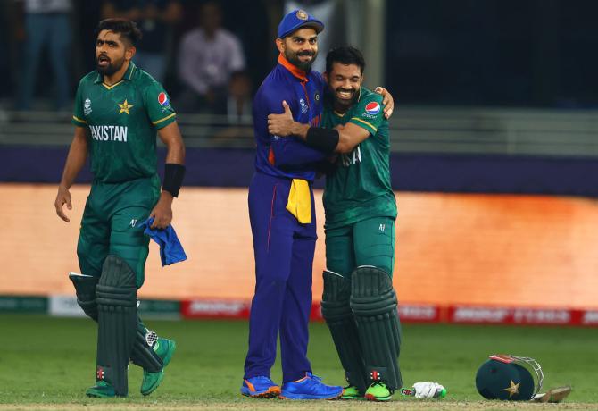  Virat Kohli and Mohammed Rizwan share a hug at the end of the T20 World Cup game in Dubai