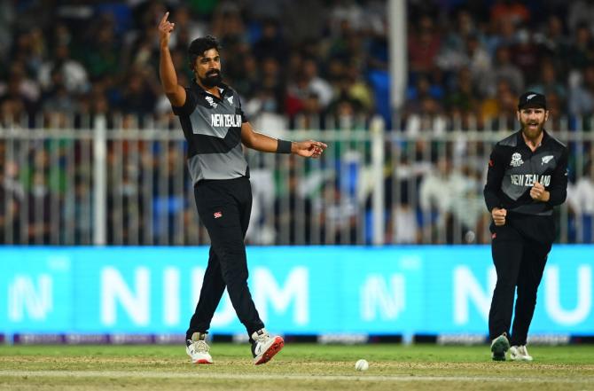 New Zealand spinner Ish Sohdi celebrates the wicket of Mohammad Rizwan.