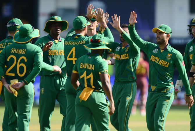 South Africa's players celebrate after Chris Gayle is dismissed.