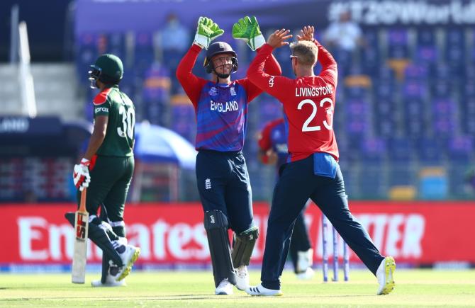 Liam Livingstone celebrates the wicket of Mahmudullah with Jos Buttler.