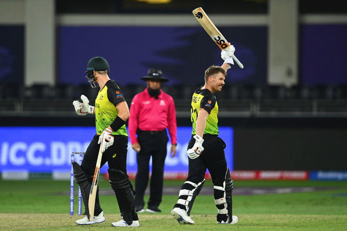 Australia opener David Warner celebrates after getting to 50 during the T20 World Cup Super 12s match against Sri Lanka, at Dubai International Stadium on Thursday. 