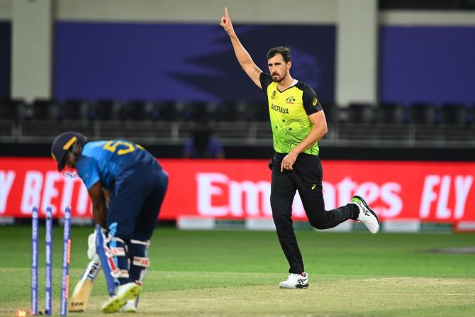 Mitchell Starc celebrates the wicket of Kusal Perera.