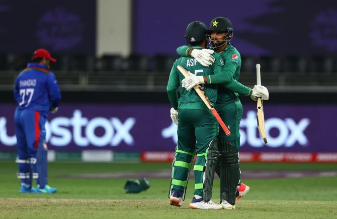 Shadab Khan and Asif Ali celebrate after taking Pakistan past Afghanistan in the T20 World Cup Super 12s match, at Dubai International Stadium, on Friday. 