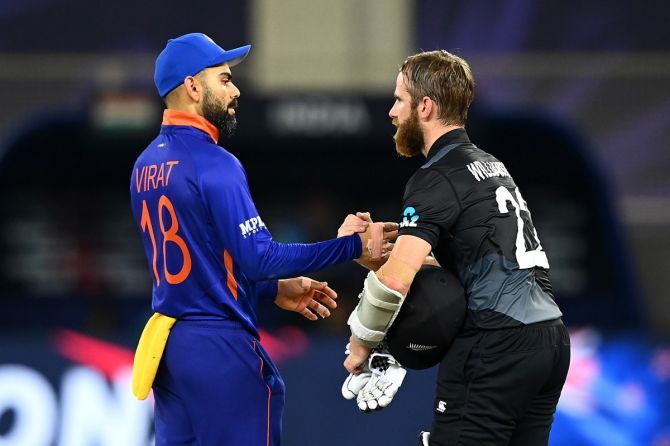 India's skipper Virat Kohli congratulates New Zealand skipper Kane Williamson after the T20 World Cup Super 12s match. 