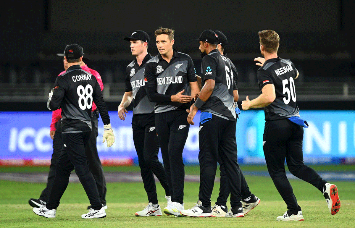 New Zealand pacer Tim Southee celebrates with teammates after dismissing India opener K L Rahul (not in picture)