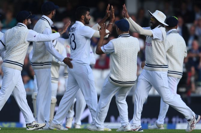 India pacer Jasprit Bumrah celebrates with teammates after dismissing England opener Haseeb Hameed.