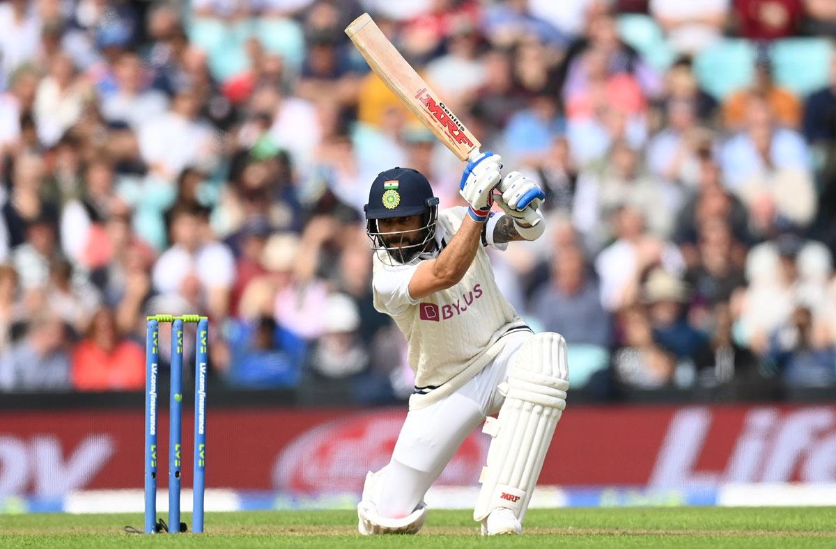 Virat Kohli goes down on one knee to send the ball to the boundary