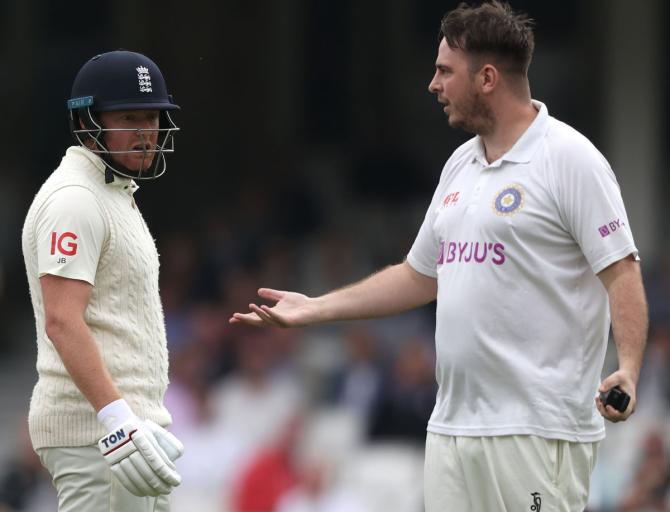 England batsman Jonny Bairstow reacts as a spectator, dressed as a cricketer, invades the pitch during the morning session during Day 2.