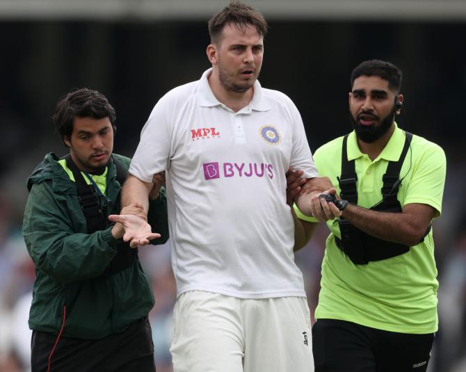 Daniel Jarvis is escorted out by security personnel at The Oval