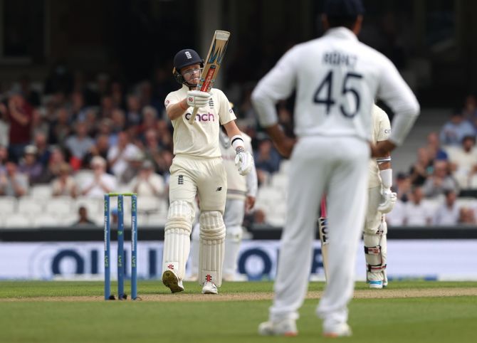 England's Ollie Pope acknowledges the applause from the crowd after scoring 50 during Day 2 of the fourth Test, at the Kia Oval in London, on Friday.
