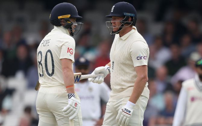England's Ollie Pope and Jonny Bairstow during their unbroken 77-run partnership for the sixth wicket. 