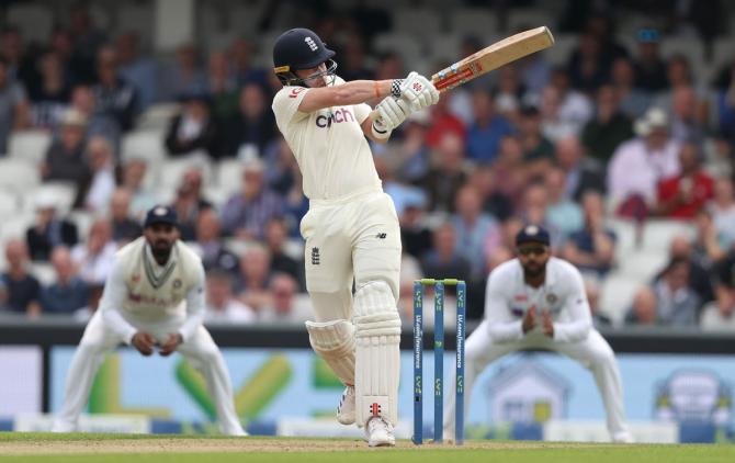 England's Ollie Pope goes on his toes to dispatch the ball to the boundary during Day 2.